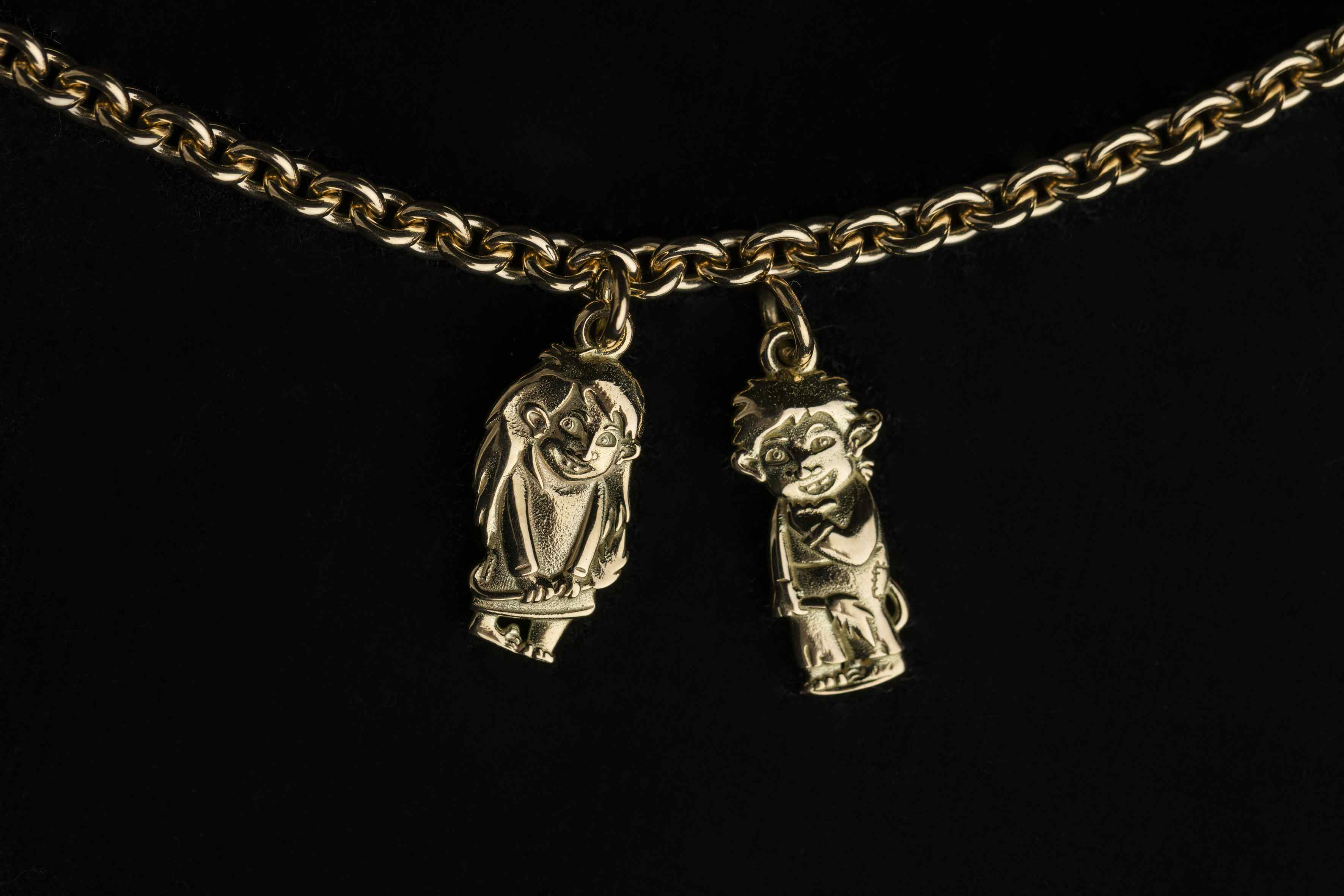 Two troll jewlery, girl and boy on a chain